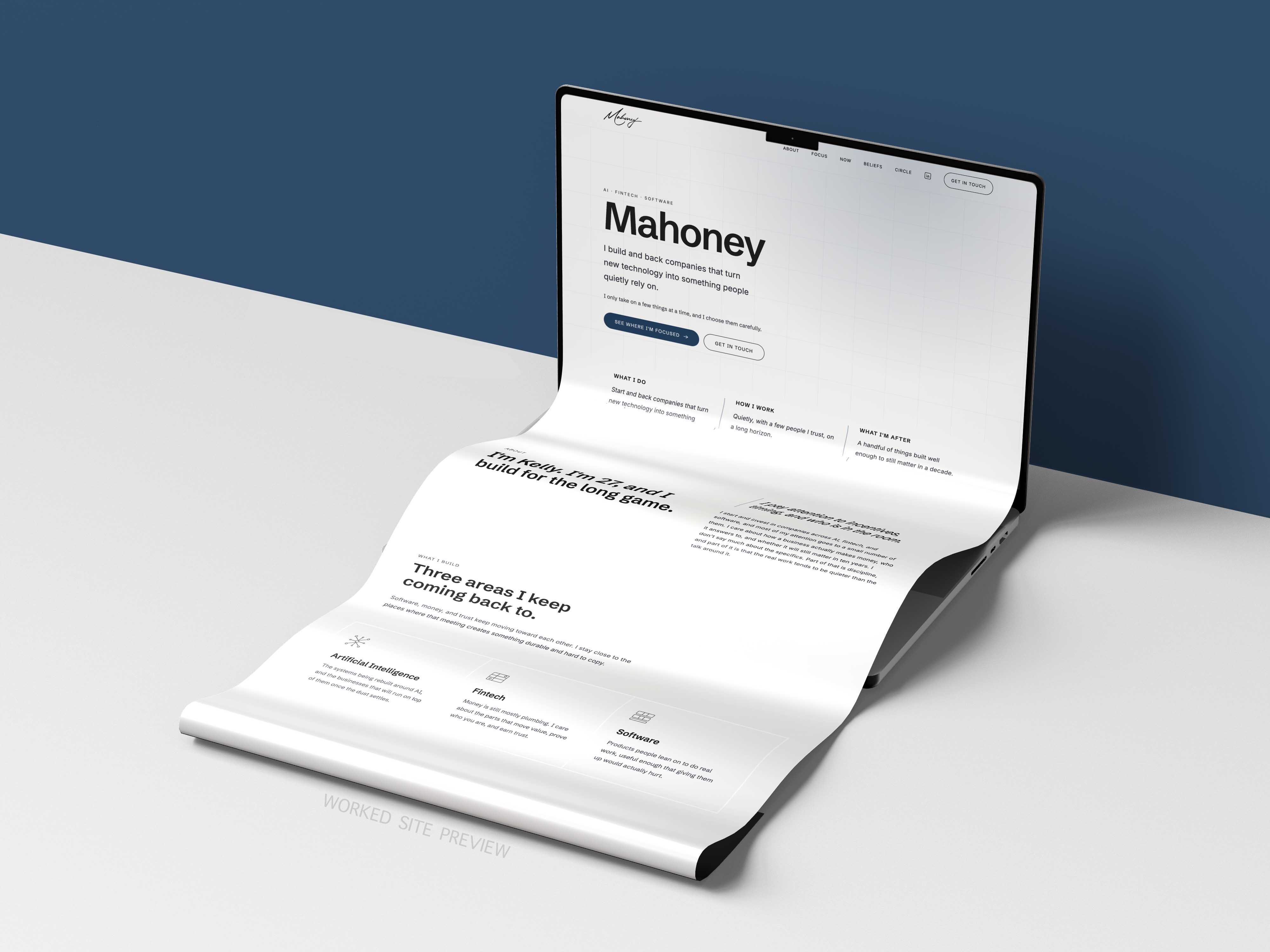 Concept laptop showing a website with text about Mahoney and technology on a blue and white background.